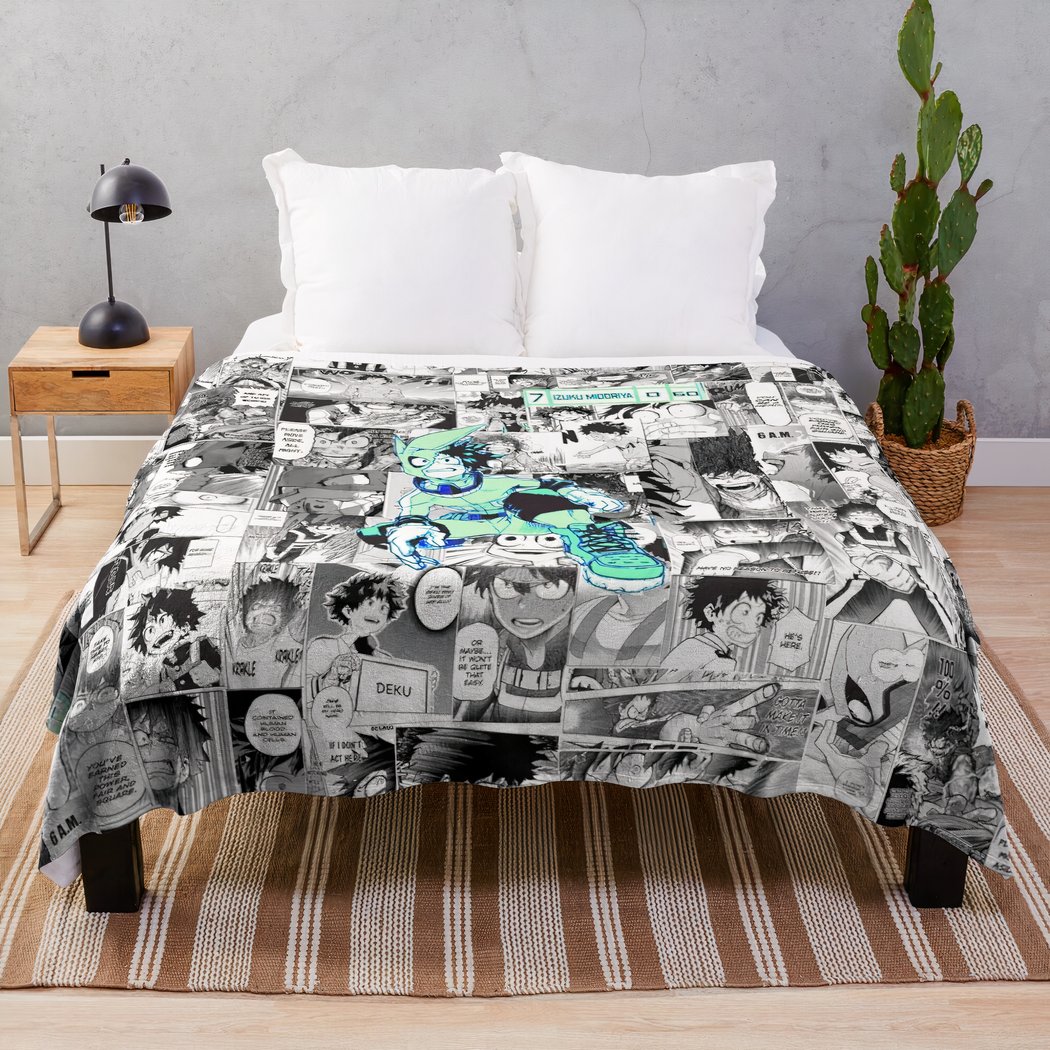 Couverture noire et blanche avec deku en vert au milieu posé sur un lit blanc